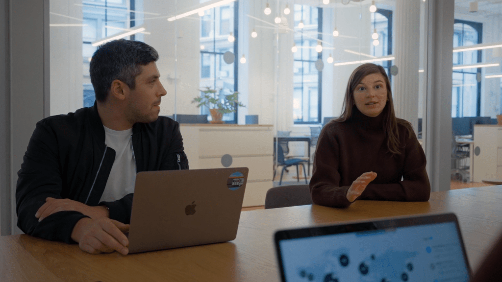 marketing people sitting around a table discussing