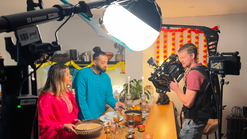 video production crew filming a family cooking