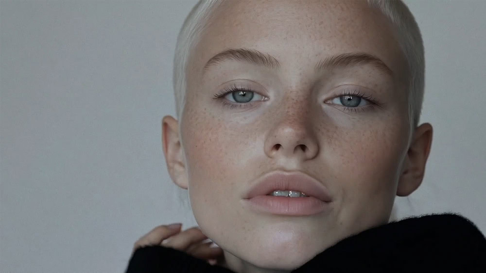 Video production team reviewing commercial footage on set