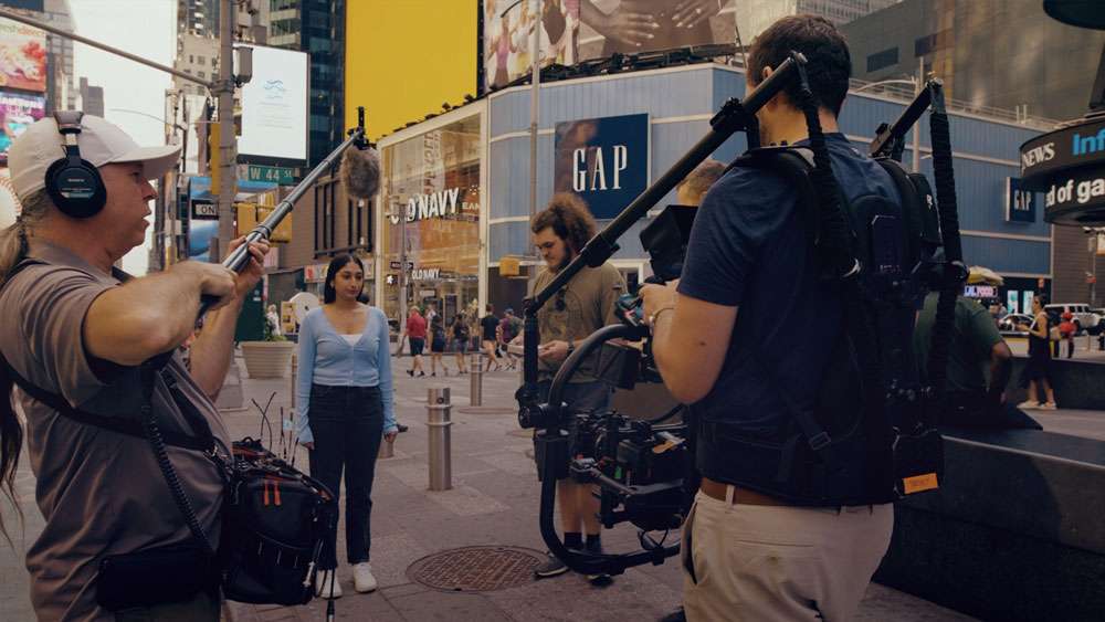 Director and crew on set during a video production shoot