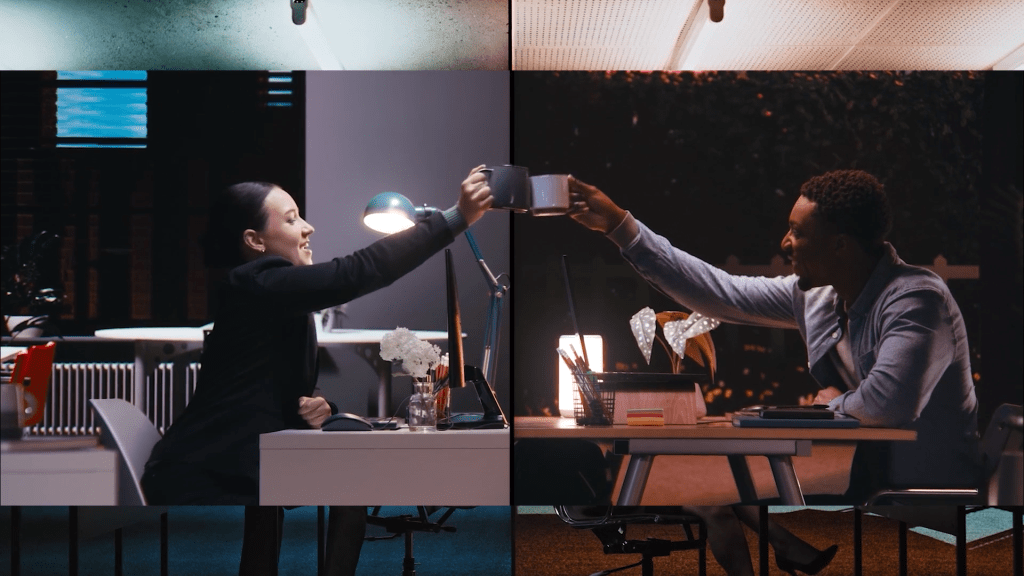 business people in virtual production studio image of two people in a virtual production video studio cheers-ing coffee mugs