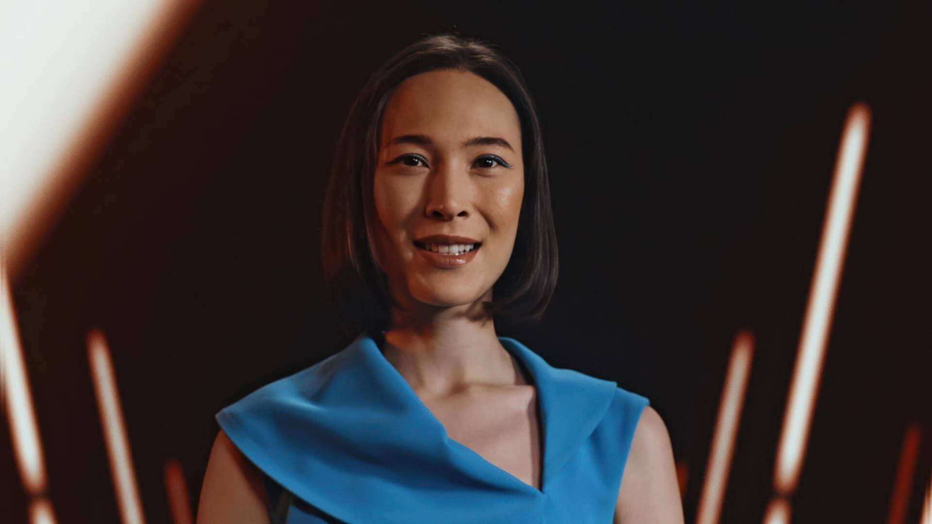 Woman in professional attire during a corporate video production